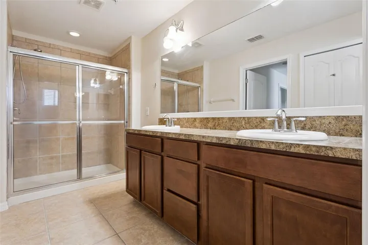 Ensuite Bathroom with shower and dual sinks