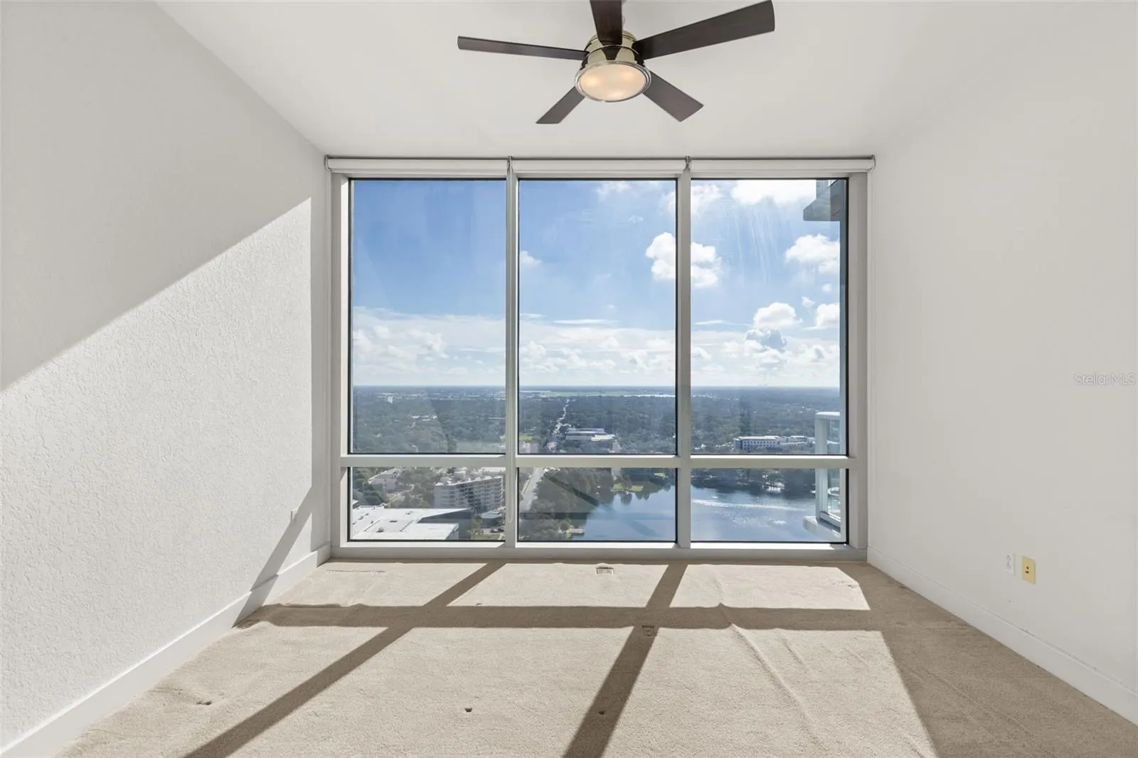 Floor to ceiling windows in primary bedroom
