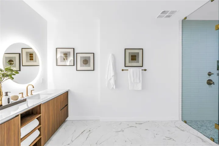 dual sink vanity , spacious walk in shower, plus separate water closet
