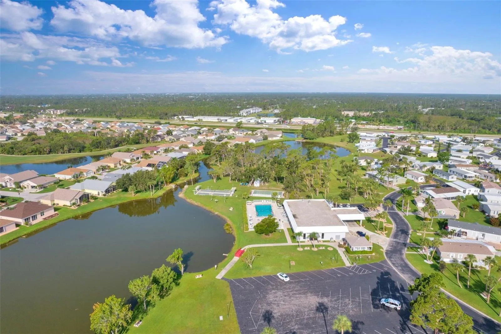Aerial of Tanner Hall, the heated swimming pool, and courts.