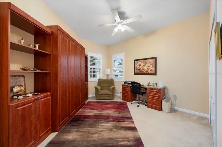 Guest bedroom with Murphy bed, built-in shelving