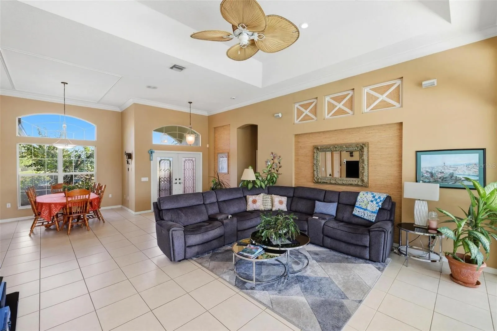 Bright, open floor plan with soaring ceiling, accented with tray ceilings and custom decorator features.