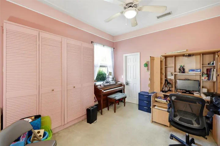 front auxiliary bedroom with walk-in closet and Murphy bed