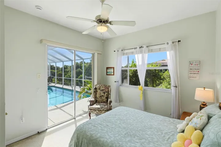 back auxiliary bedroom opens to the pool &amp; lanai