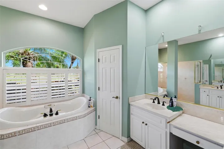 Water closet and glamour vanity area.