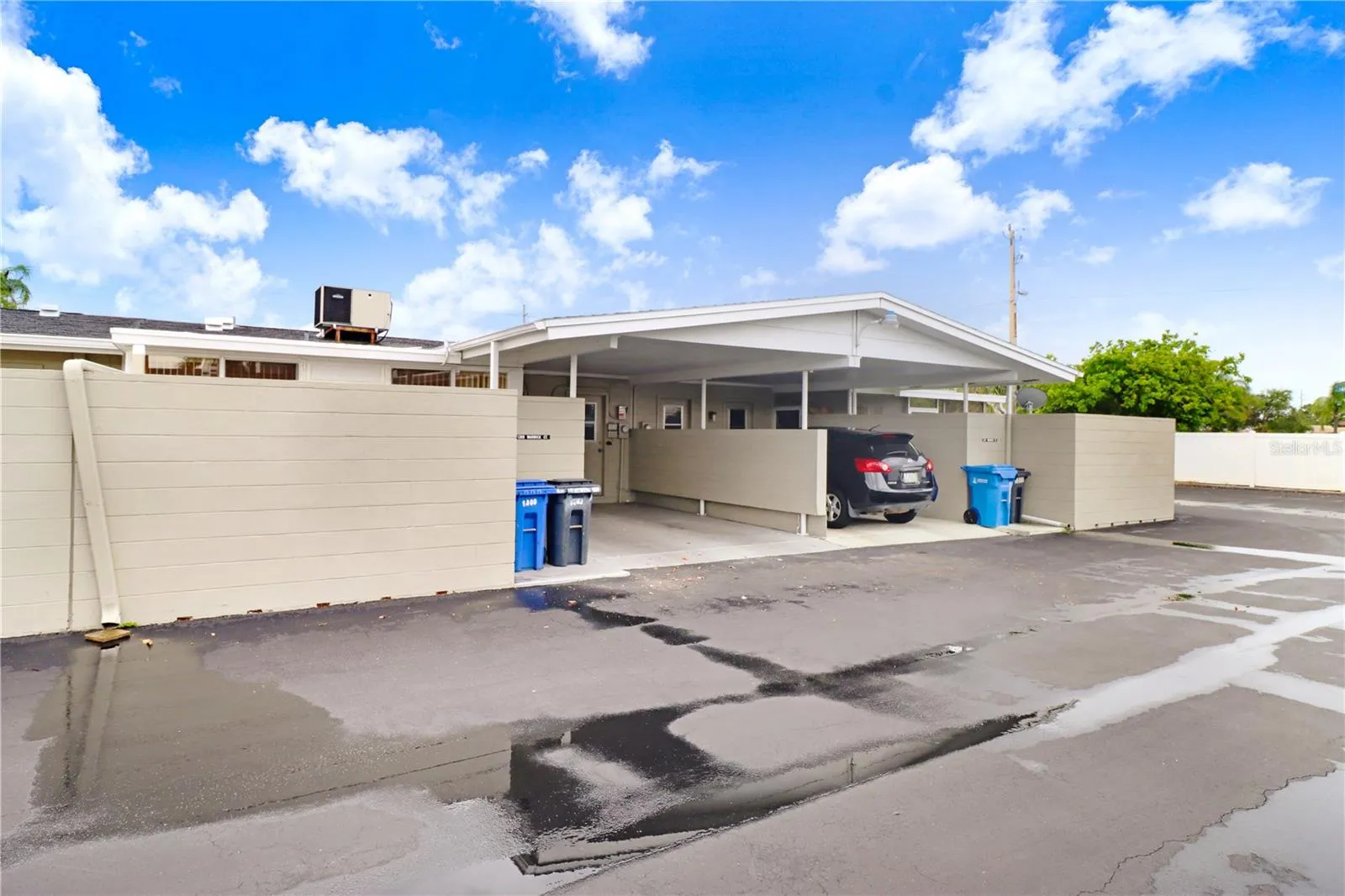 Rear view of the property showcasing the exterior access.