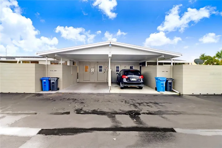 The carport on the left belongs to this listing.