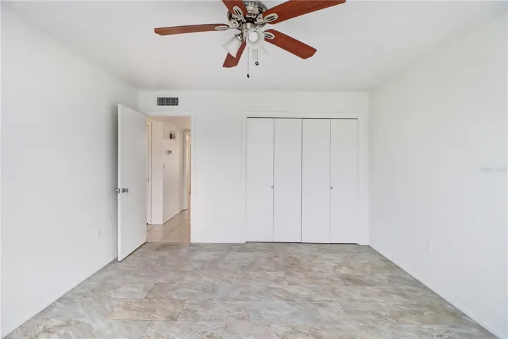 Primary bedroom featuring ample natural light and easy care tile floor.