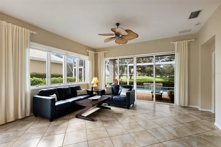 Spacious living room with views of the course