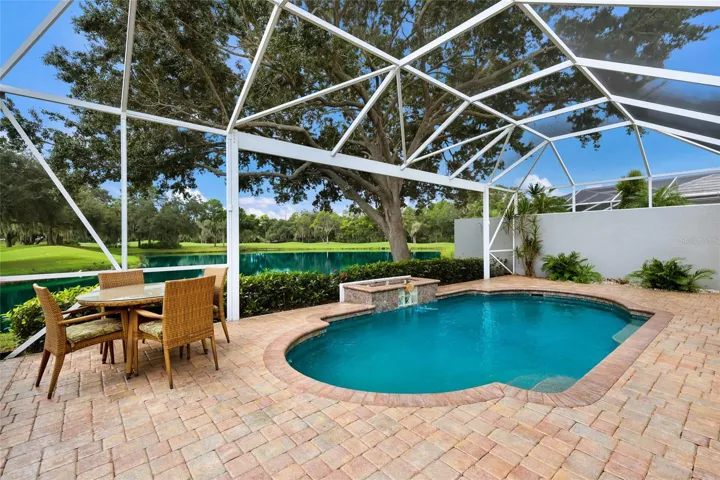 Expansive pavered lanai with panoramic screen