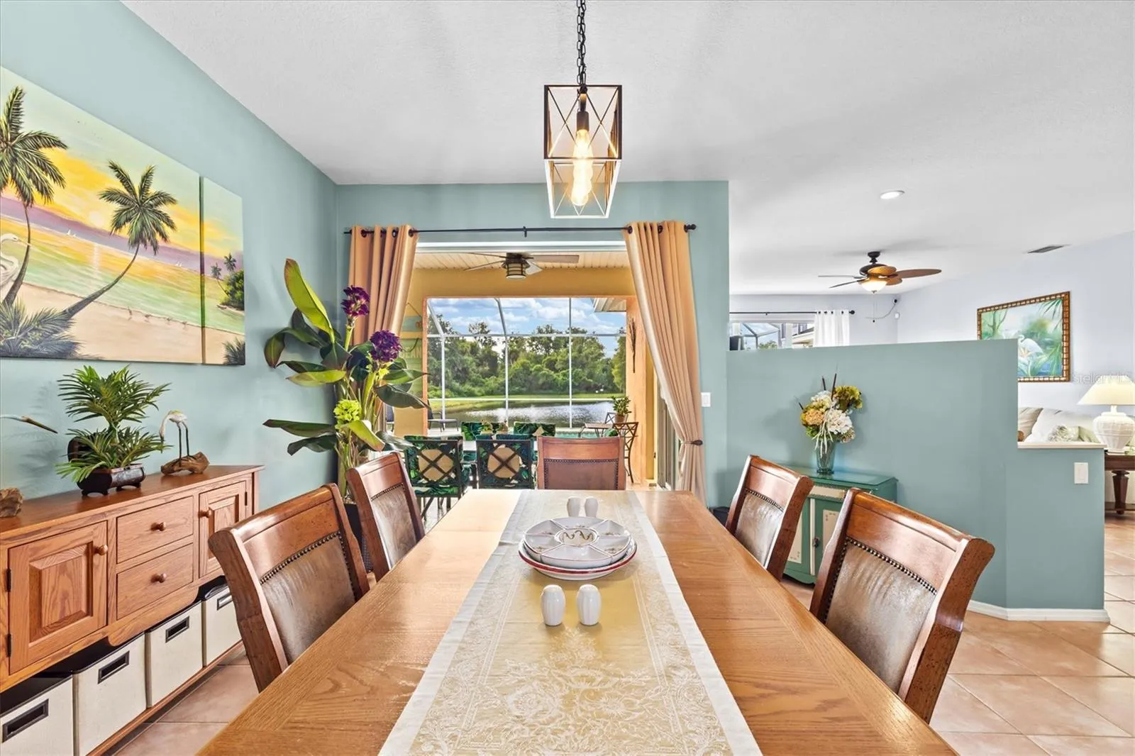 When first walking into home-sliders open to pool and water view