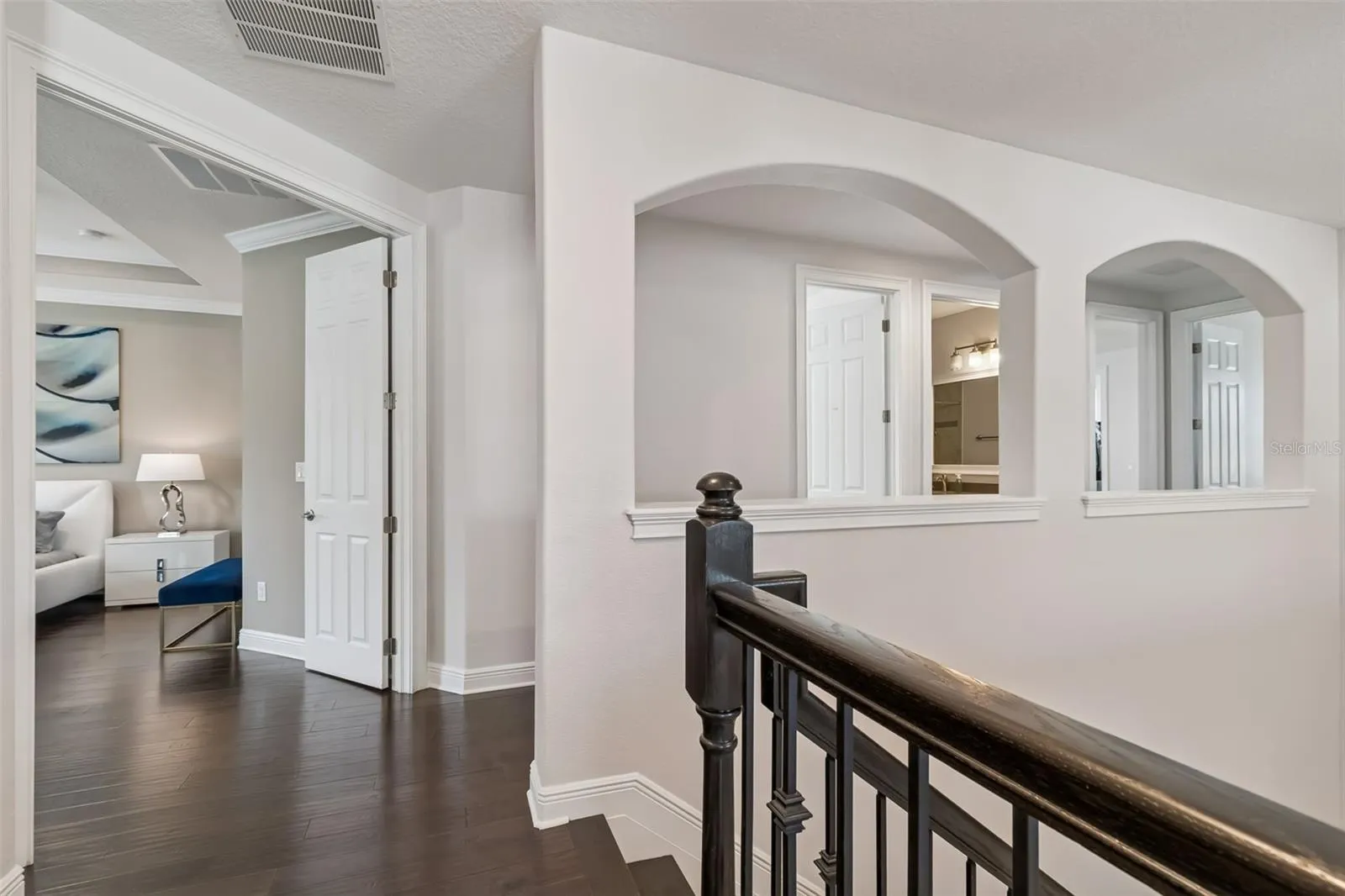 The upstairs landing opens to the loft and bedroom wing.