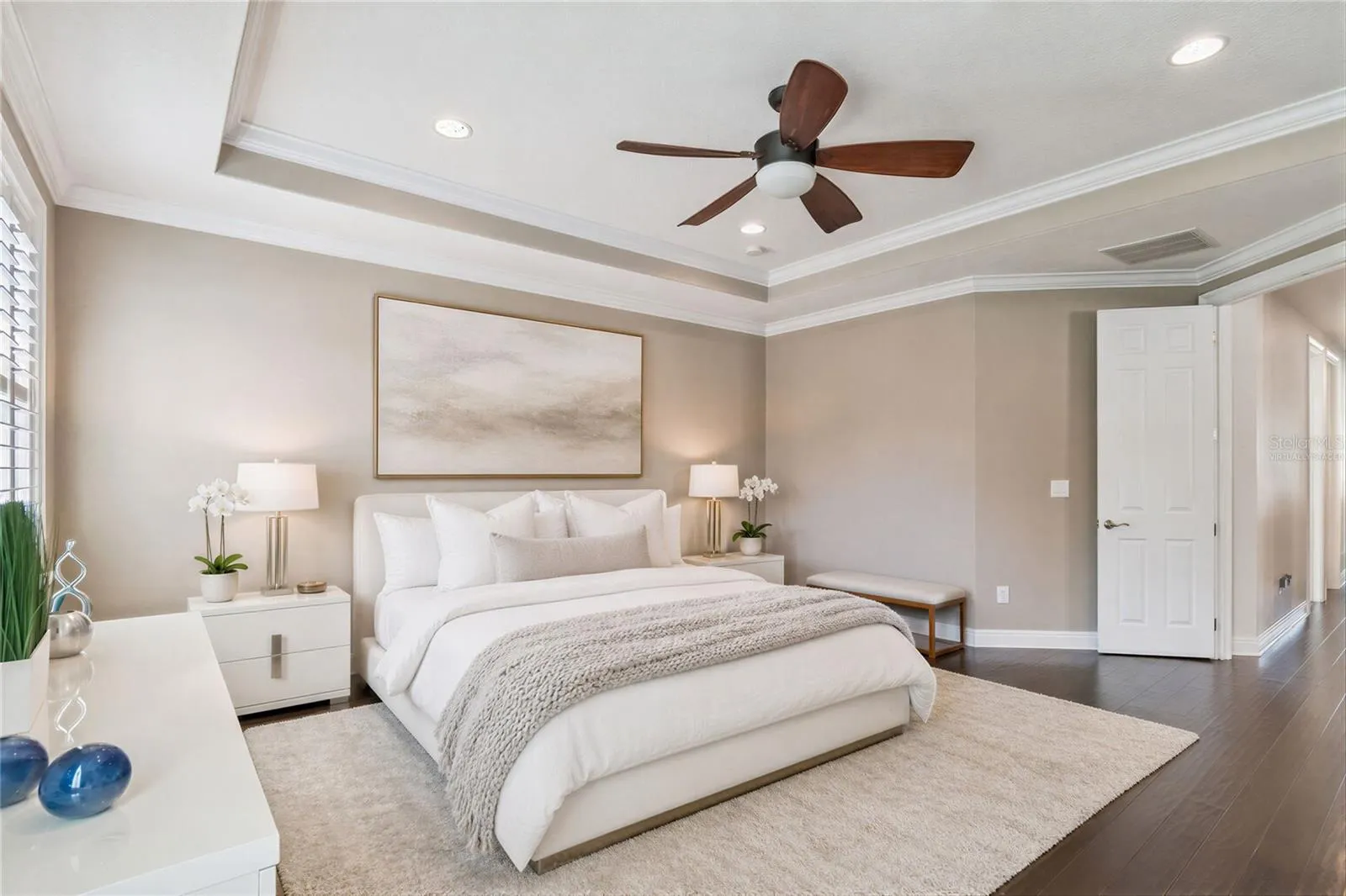 Virtually staged primary bedroom illustrating one way to furnish the space.