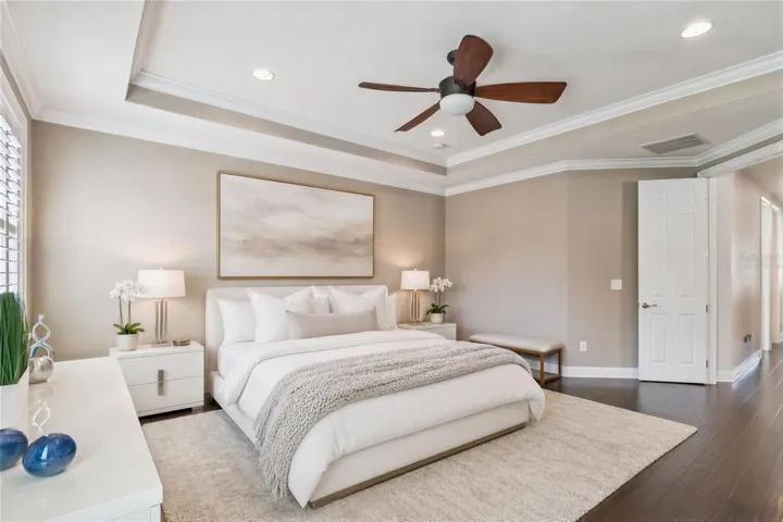 Virtually staged primary bedroom illustrating one way to furnish the space.