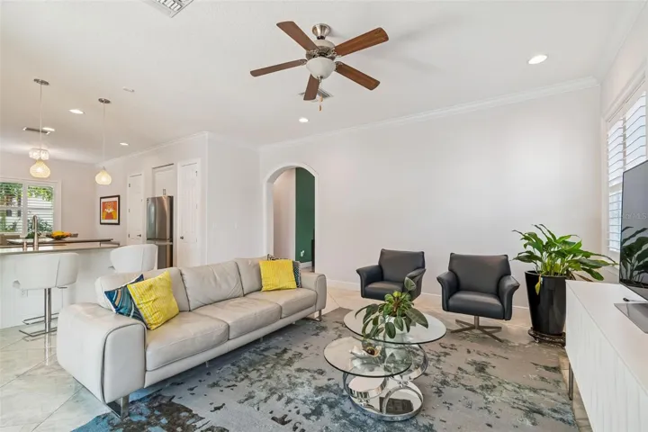 The living room opens to the kitchen, keeping both spaces connected.