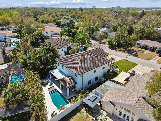 Aerial view of the house, showcasing the expansive backyard and surrounding landscape.