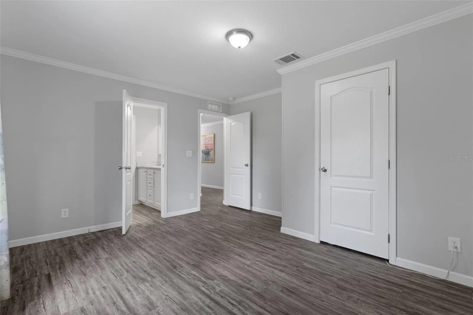 Bedroom 3 with LVP flooring and convenient bath access Jack and Jill.