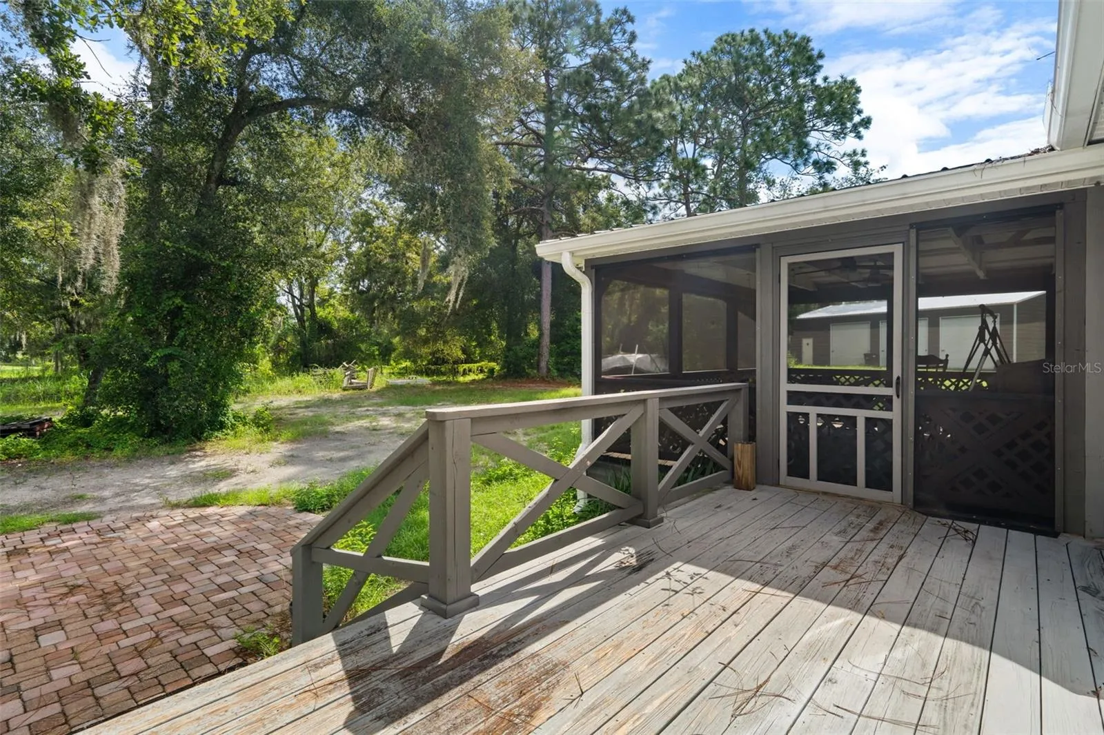 A second look at the spacious screened porch and outdoor living area.