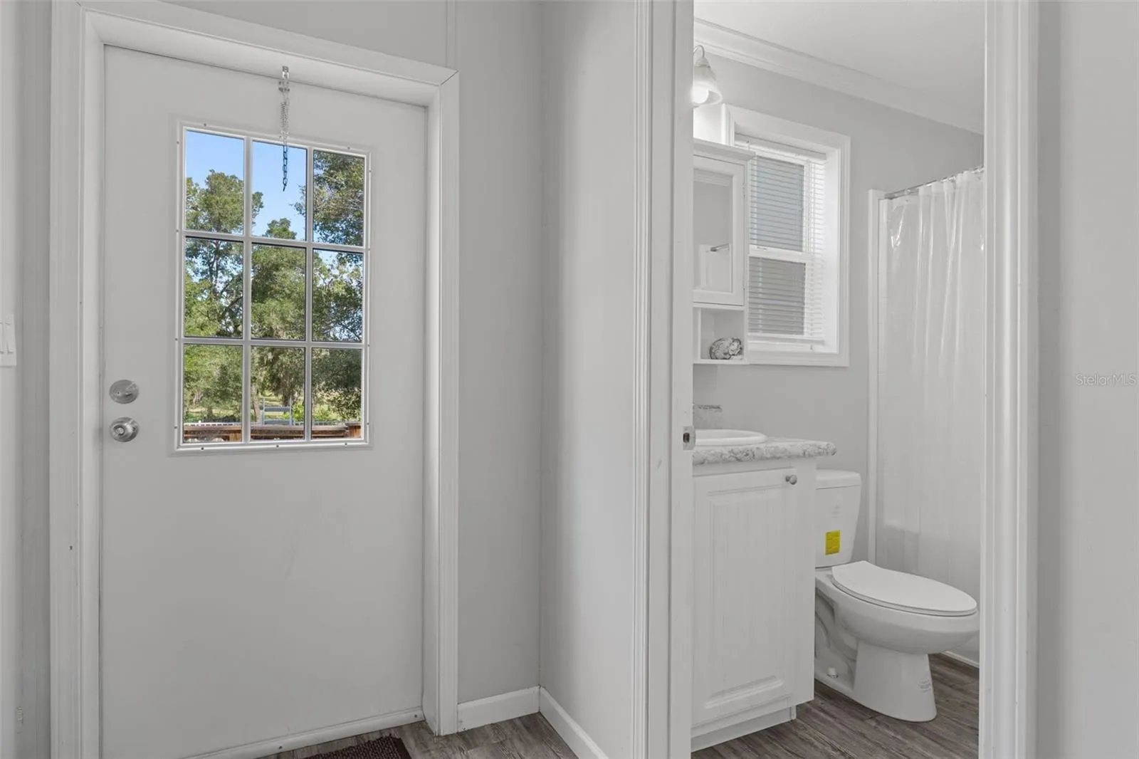 Hallway with proximity of bath 3 to door and pool area.