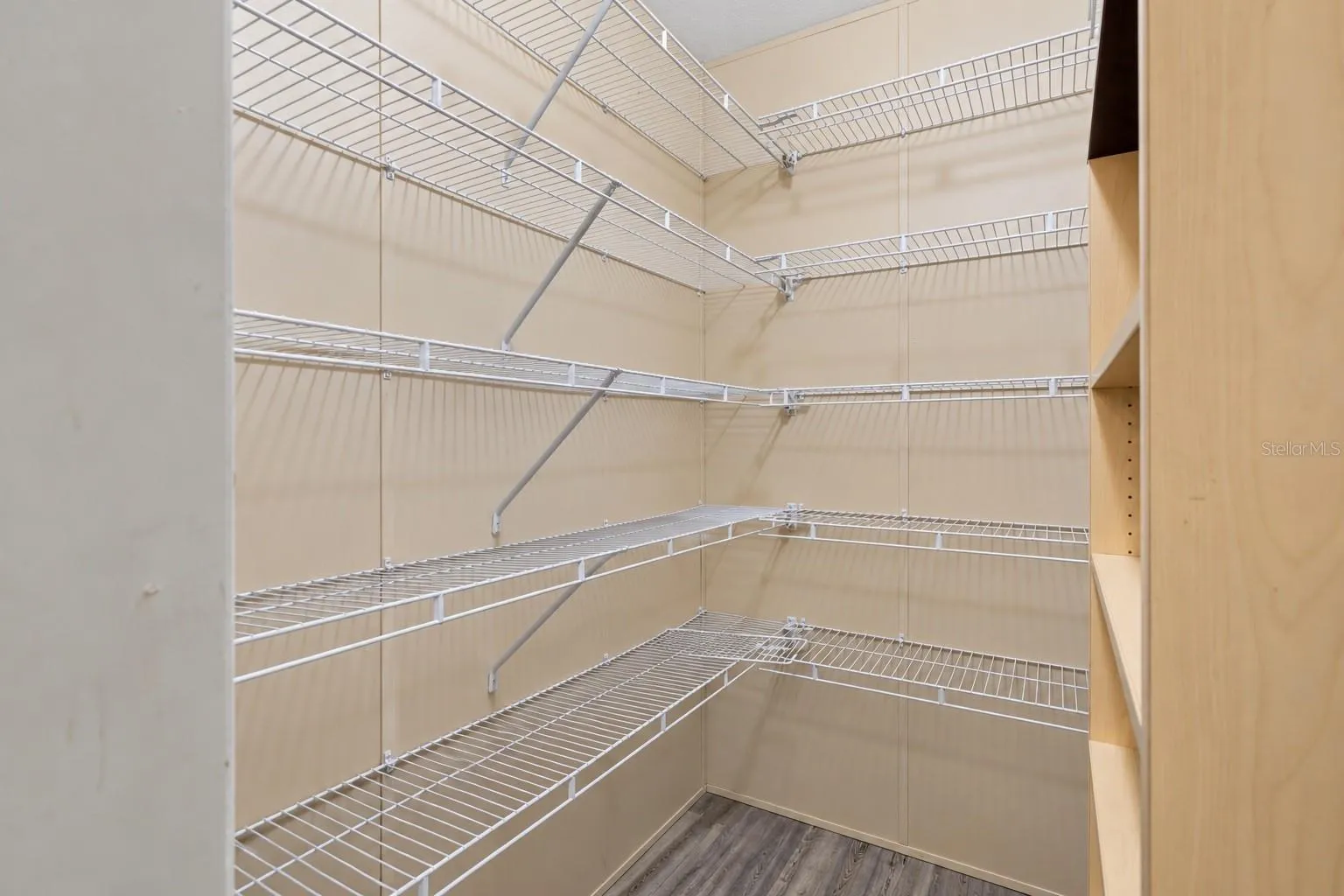 Walk-in/ hidden pantry Provides additional storage just steps from the kitchen.