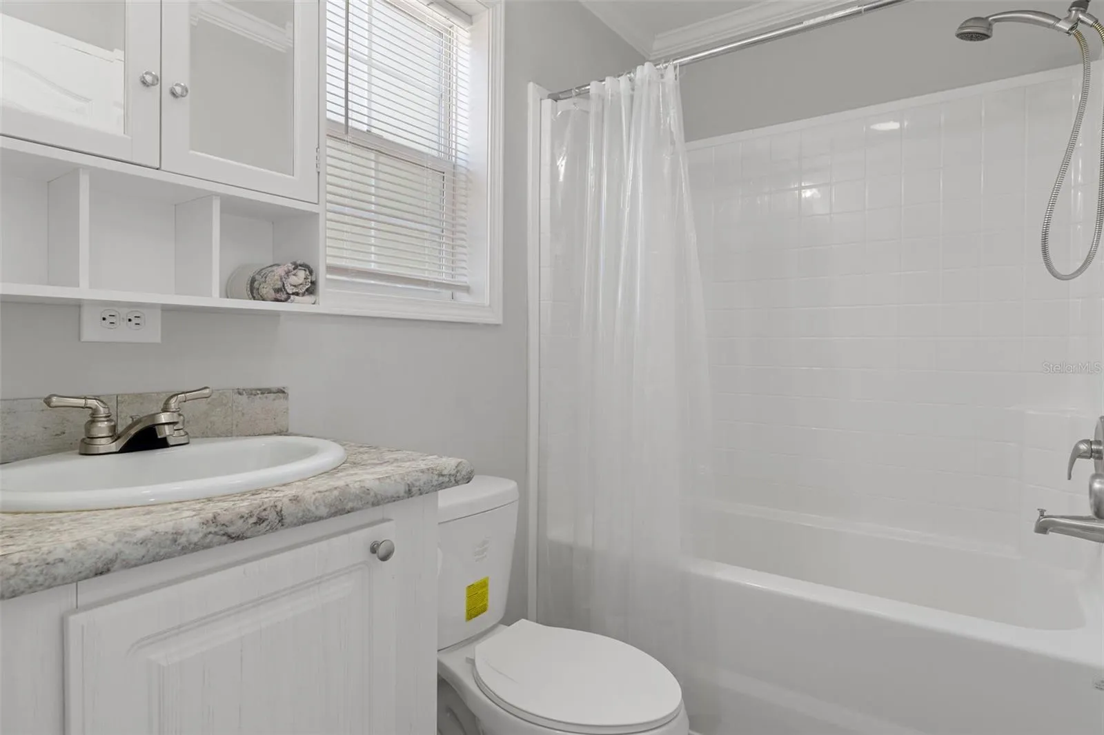 Bathroom 3 with shower tub combo convenient to pool with LVP flooring.