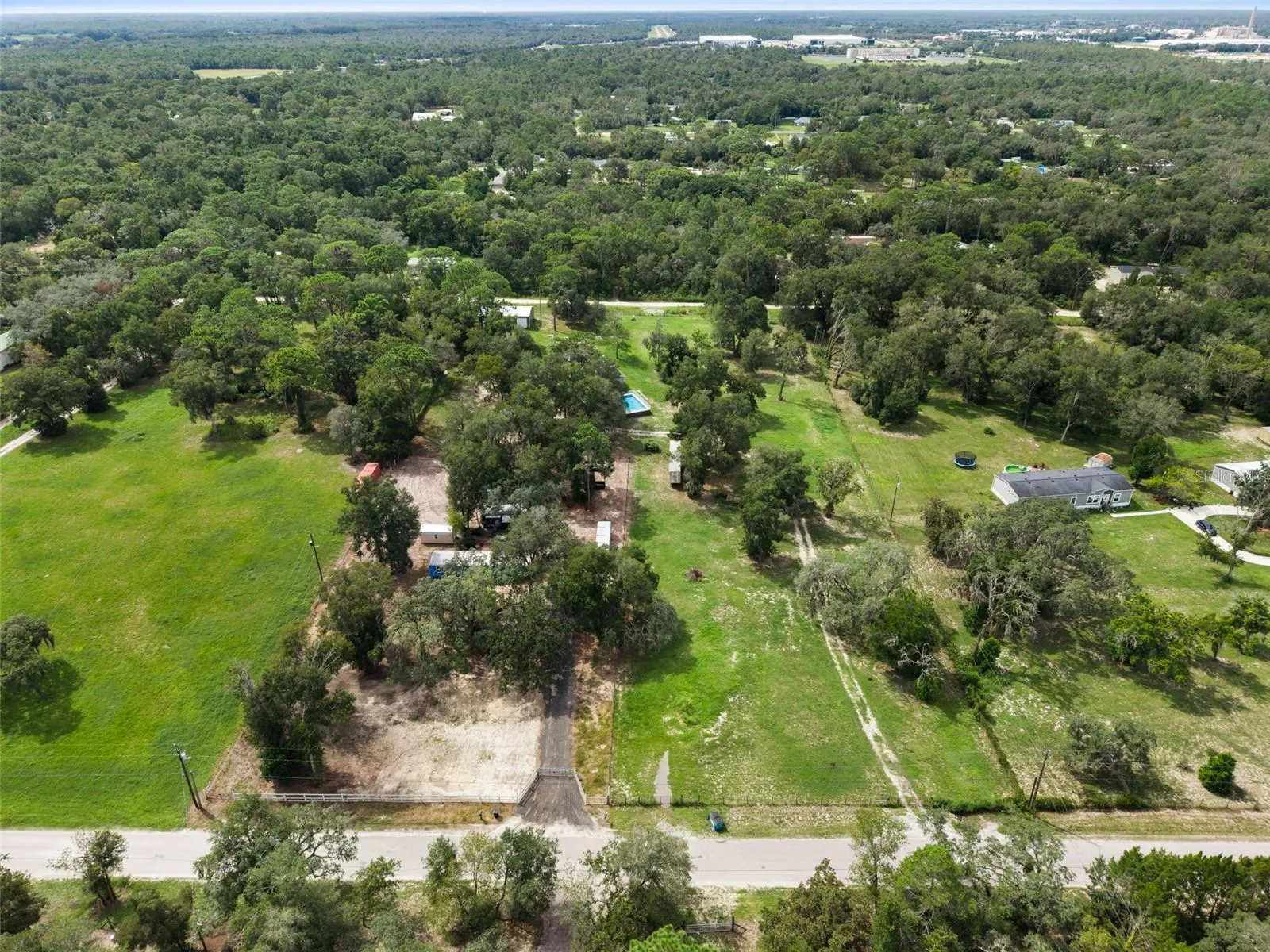 Wide aerial perspective of the property and surrounding area viewed from Platinum dr.