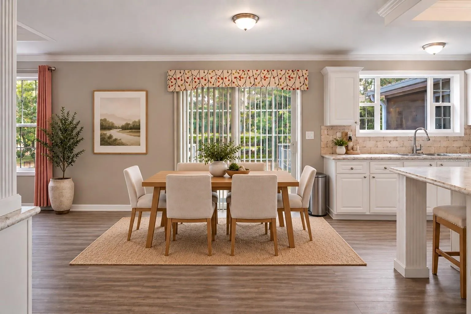Virtually staged dining area illustrates one option for using this flexible open space. Furnishings and decor are digital and not included.