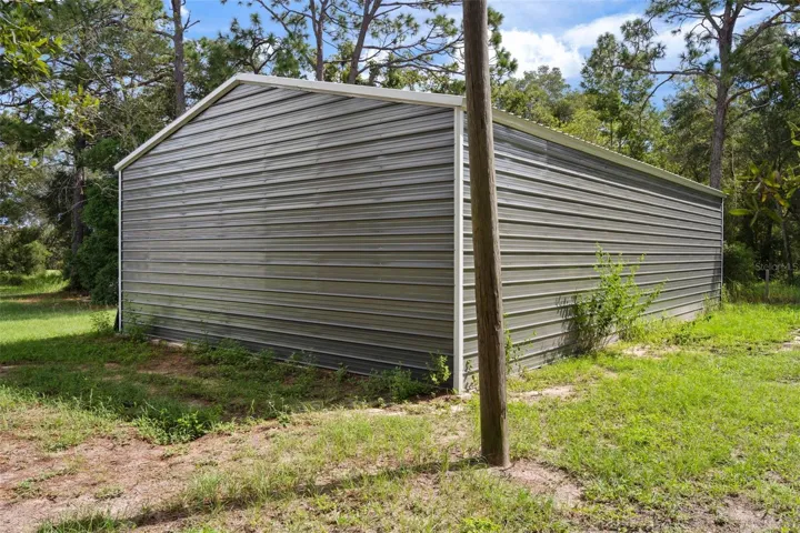 Back of workshop. Three roll up doors, 10’x12’ provide access to the individual workshop bays.