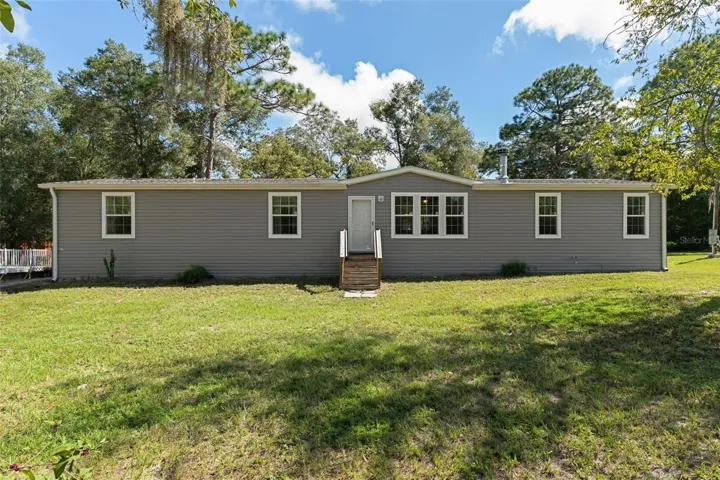 Welcome to 16344 Platinum Dr - a 2020 home set on 3.46 acres in Spring Hill, Pasco County