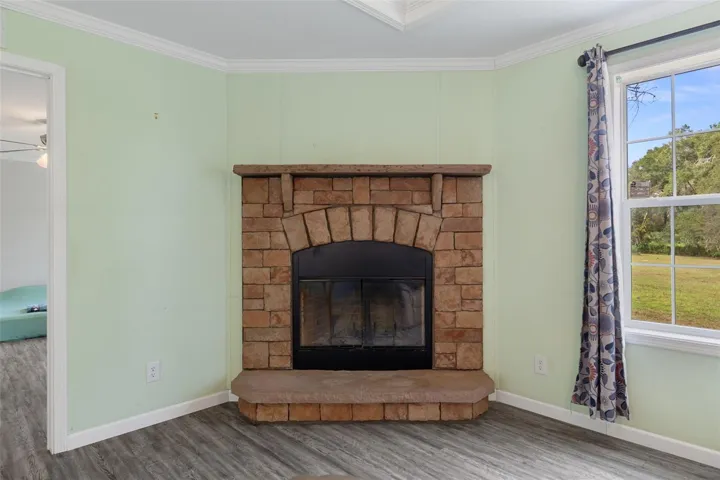 Stone-surround fireplace creates a distinctive focal point in the living area.