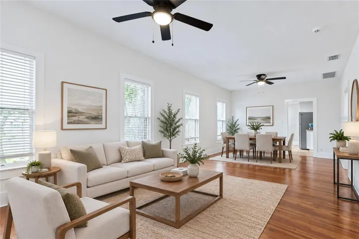 Virtually staged image. Living Room and Dining.
