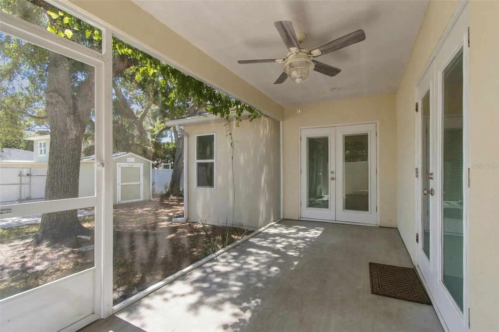 back porch. french doors in center of photo are to the primary bdrm