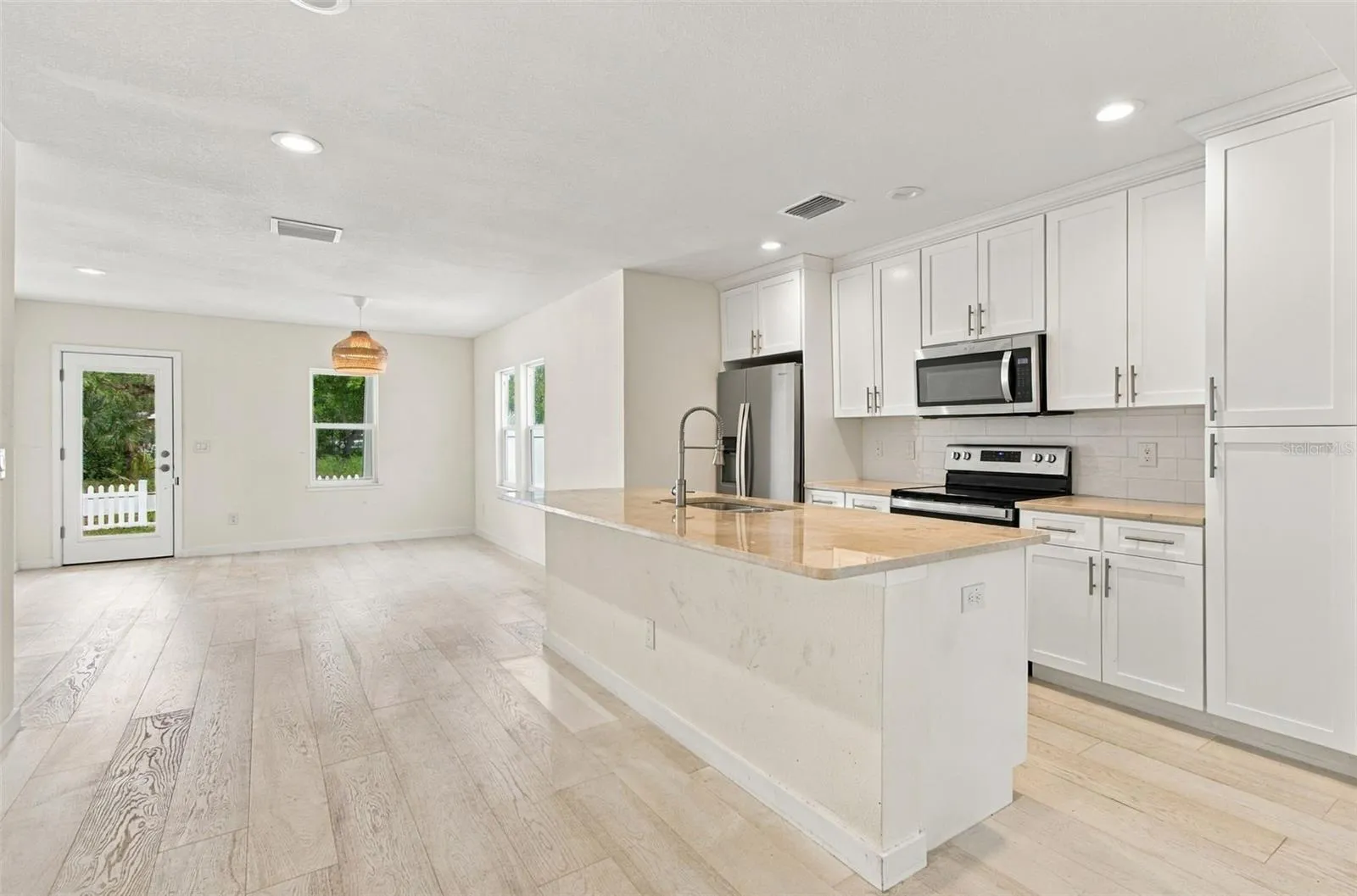 View of the kitchen and front door.