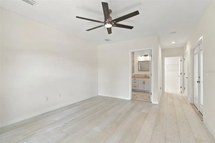 primary bdrm view of bath and closet doorways
