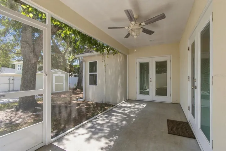 back porch. french doors in center of photo are to the primary bdrm