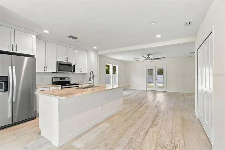 Enjoy this beautiful kitchen in the center of the home.  The laundry closet is on the right.