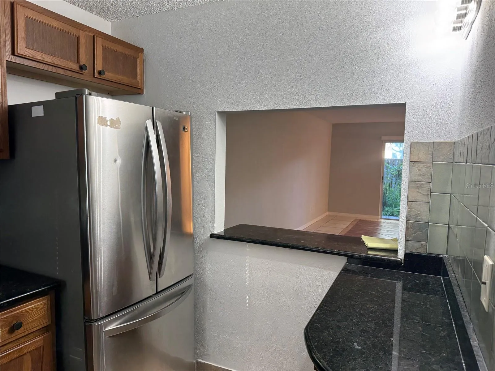 FROM SINK LOOKING TO REFRIGERATOR COFFEE &amp; SMALL APPLIANCE STATION BREAKFAST BAR