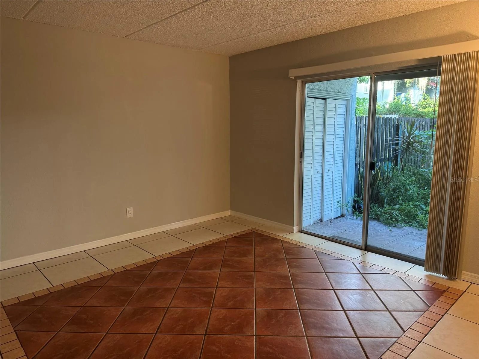 ZOOMED IN FROM INTERIOR STAIRS TO 1ST FLOOR REAR PATIO &amp; LAUNDRY CLOSET