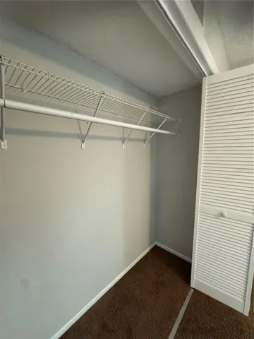 GUEST BEDROOM STARDARD CLOSET WITH BI-FOLD DOORS
