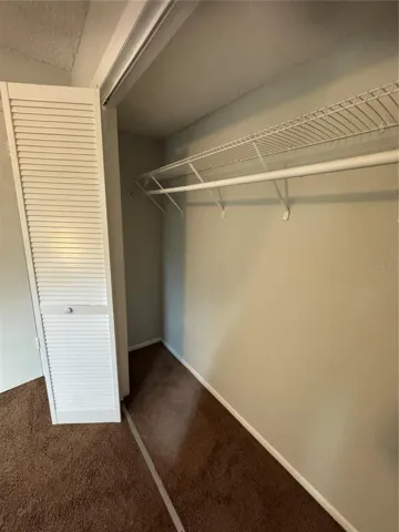 GUEST BEDROOM STARDARD CLOSET WITH BI-FOLD DOORS