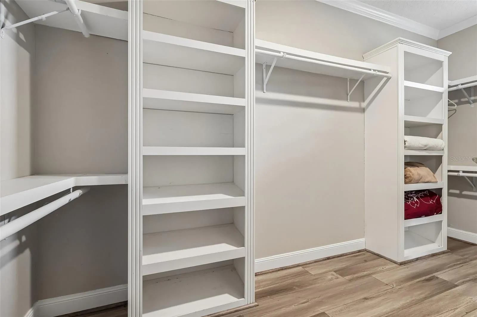 The enormous Primary walk-in closet with built-in shelving.