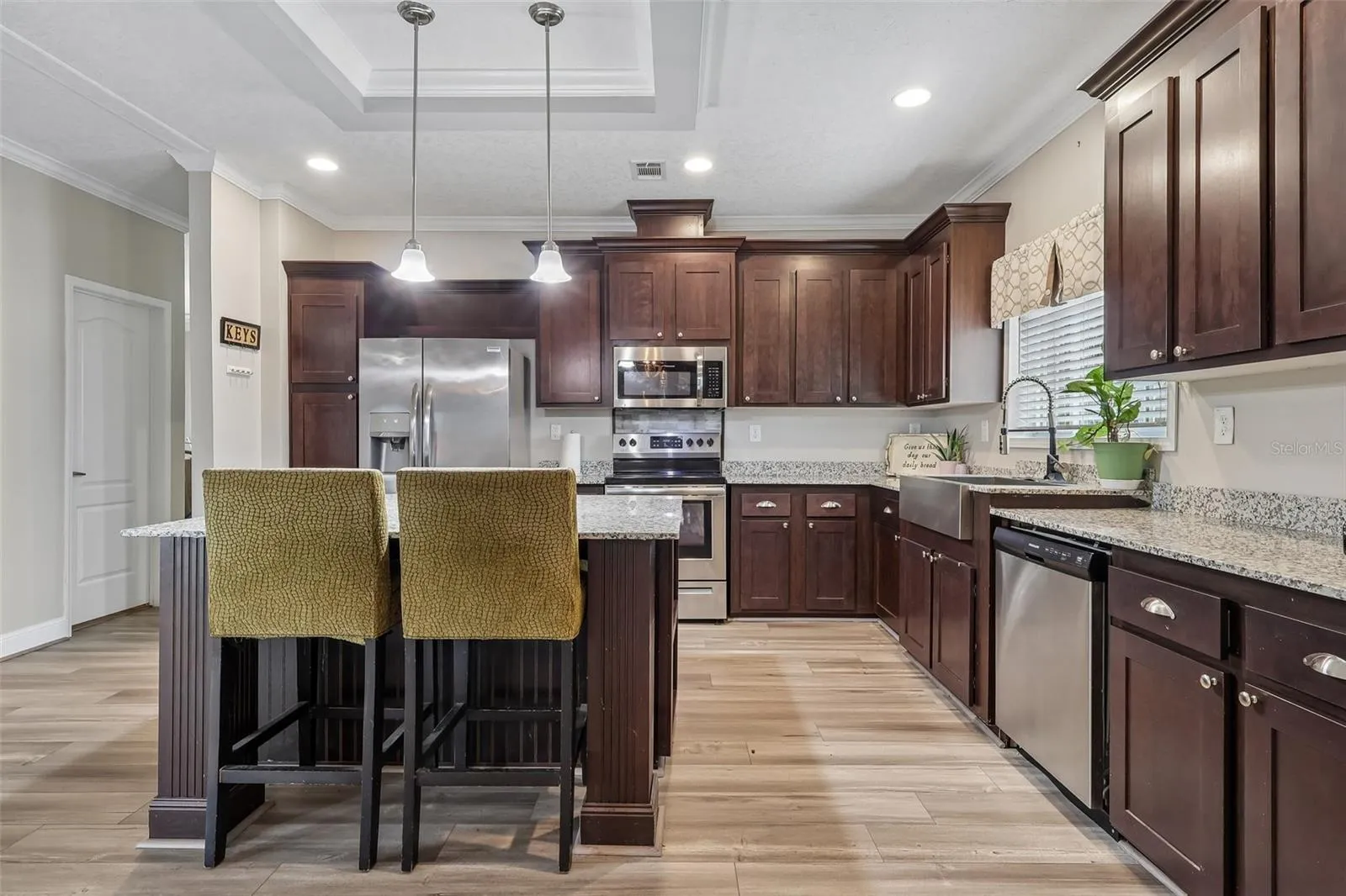 The Kitchen features ample cabinetry and generous counter space.