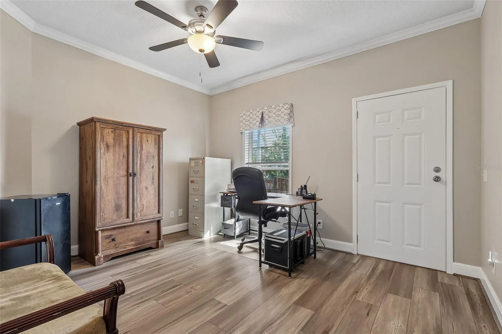Bedroom 4 has its own EXTERIOR ACCESS DOOR, making it an especially versatile space that could easily function as a HOME OFFICE, flex room, guest space, or hobby room.