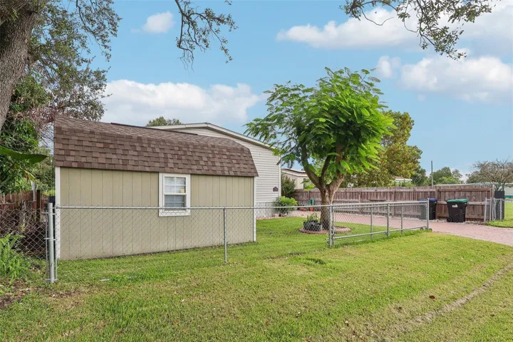A manual gate provides access to the FENCED YARD.