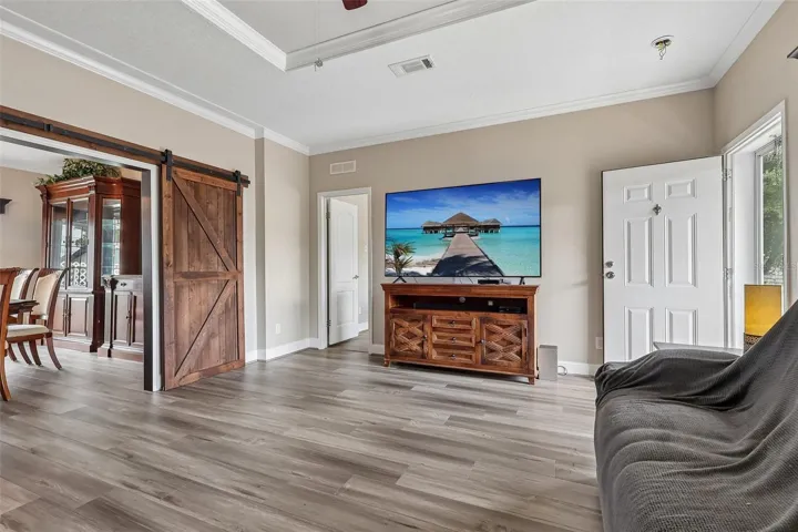 Inside, LUXURY VINYL PLANK FLOORING, 9-foot ceilings, and CROWN MOLDING throughout create a polished and cohesive feel.