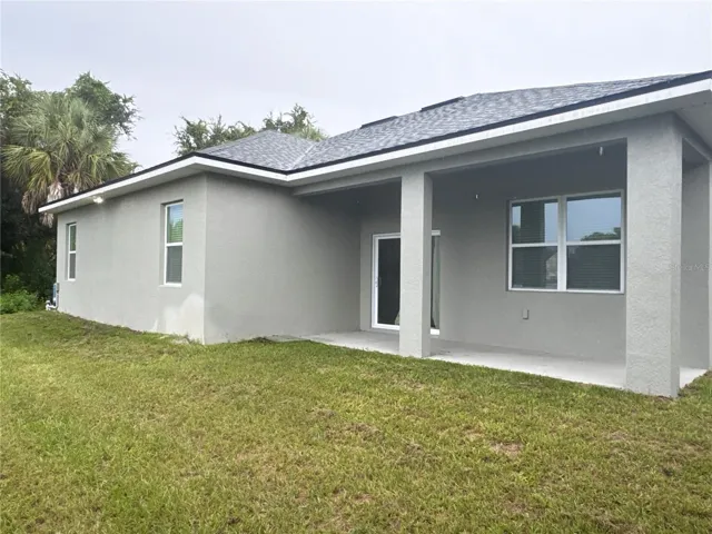 Back of the house with covered patio