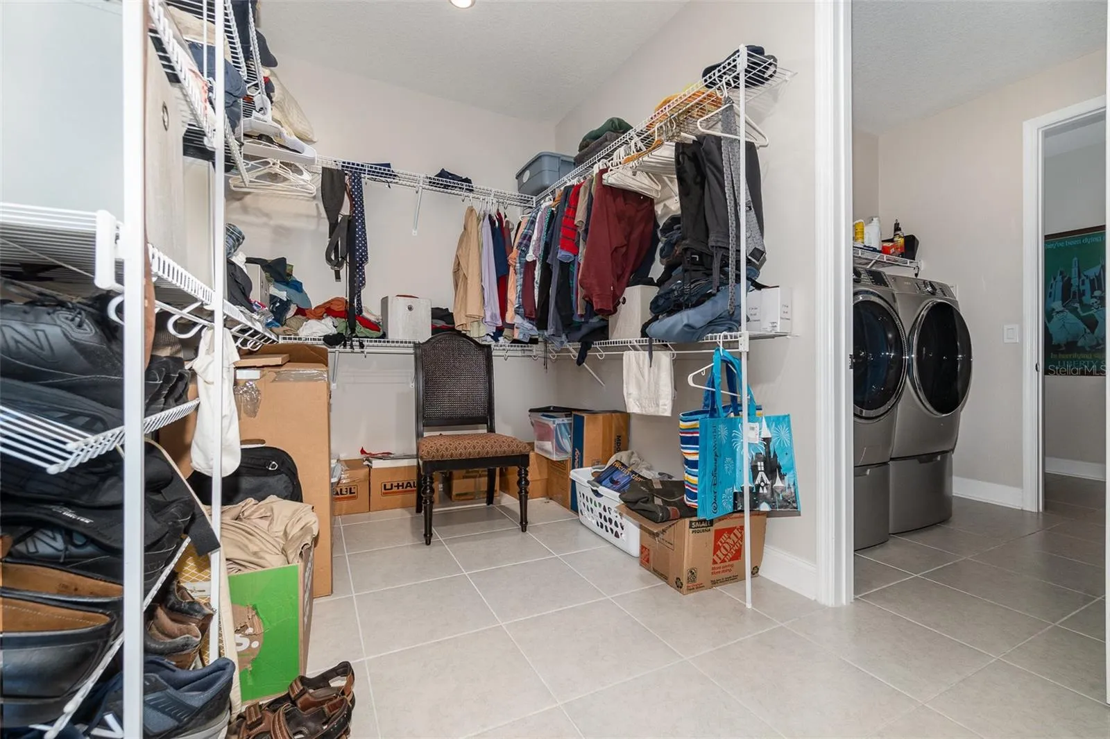 Huge Primary Bedroom Walk in Closet that connects to Laundry Room. Laundry Room connects to hallway with 2 other bedrooms and a bath