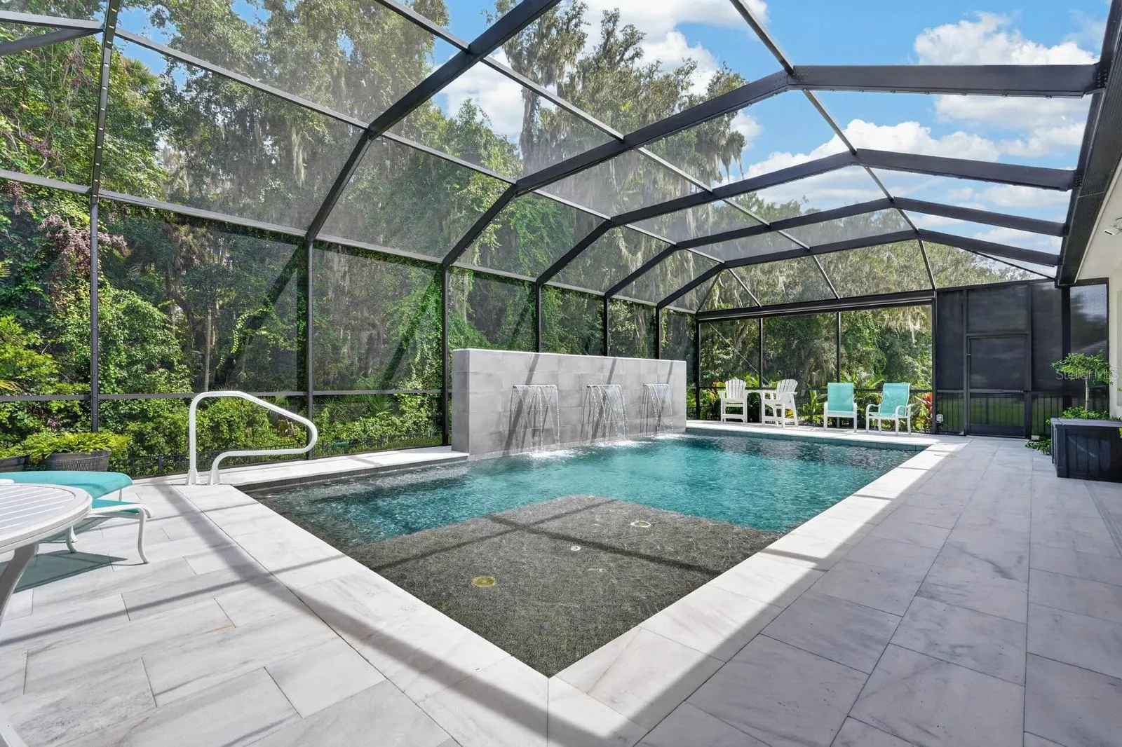 Saltwater heated pool has a sundeck, spa with jets and a 6.5 foot deep end