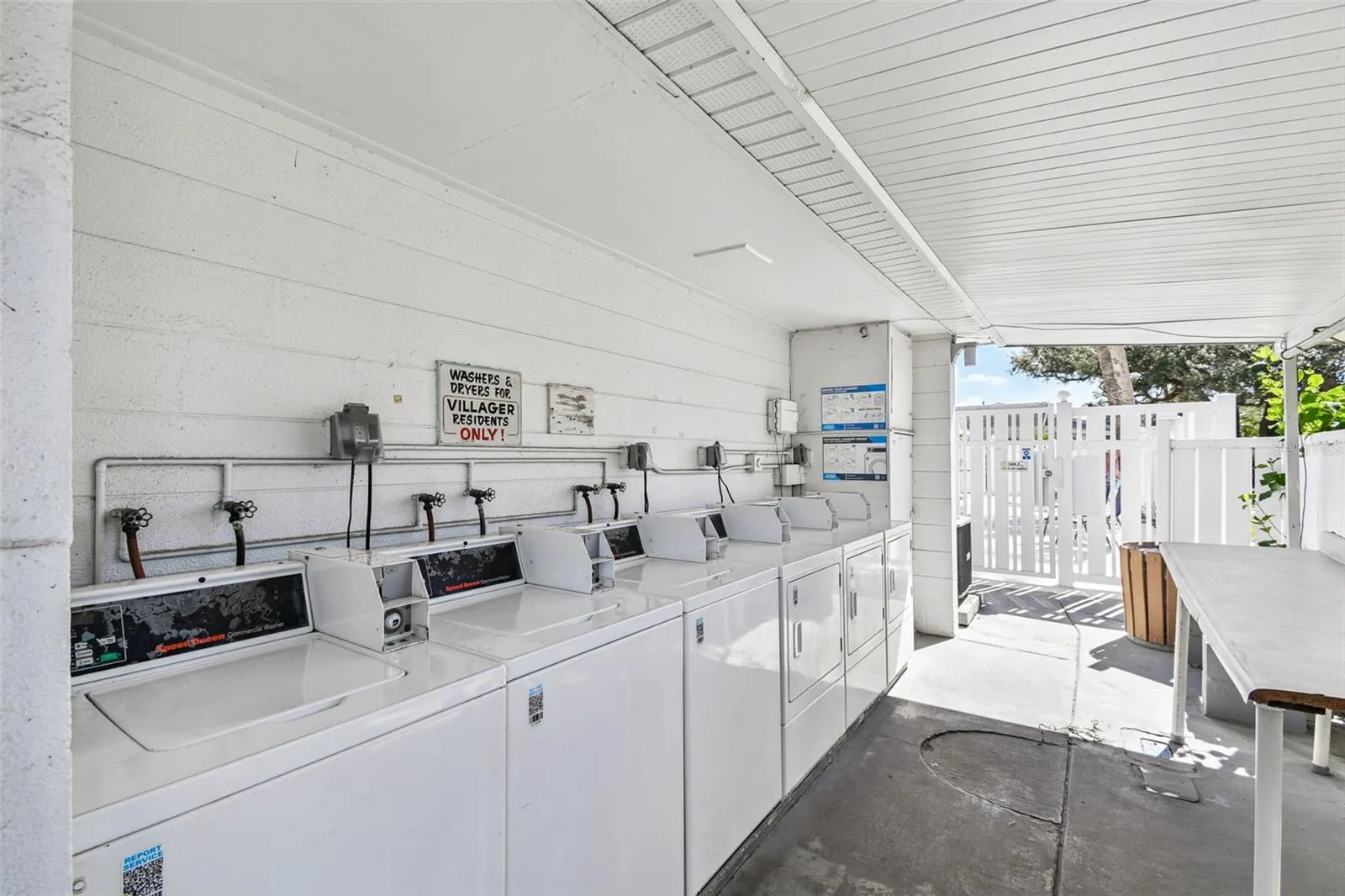 3 washers/dryers by the pool area