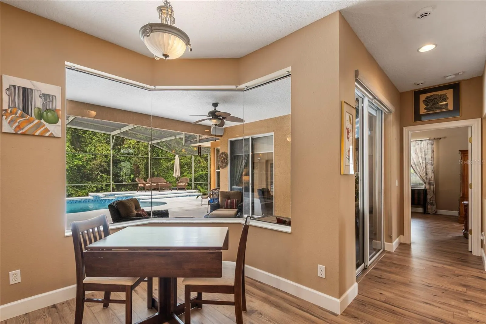 Bay Window Breakfast Nook with breathtaking view of sparking pool, hot tub and lanai